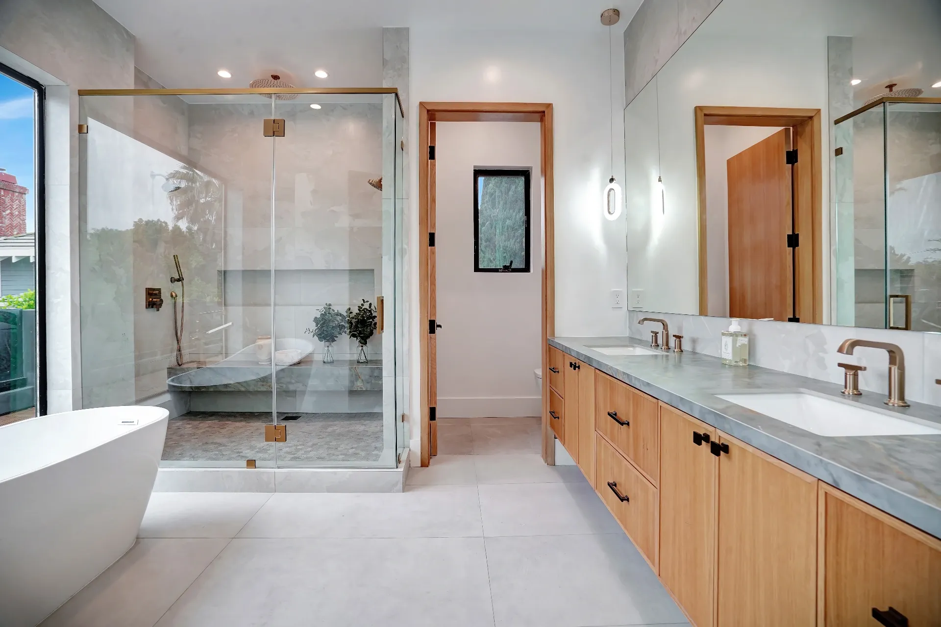 15602 Morrison St — Bathrooms: 15602 Morrison St — Luxury primary bathroom with glass-enclosed shower, freestanding tub, dual vanities, and floor-to-ceiling windows