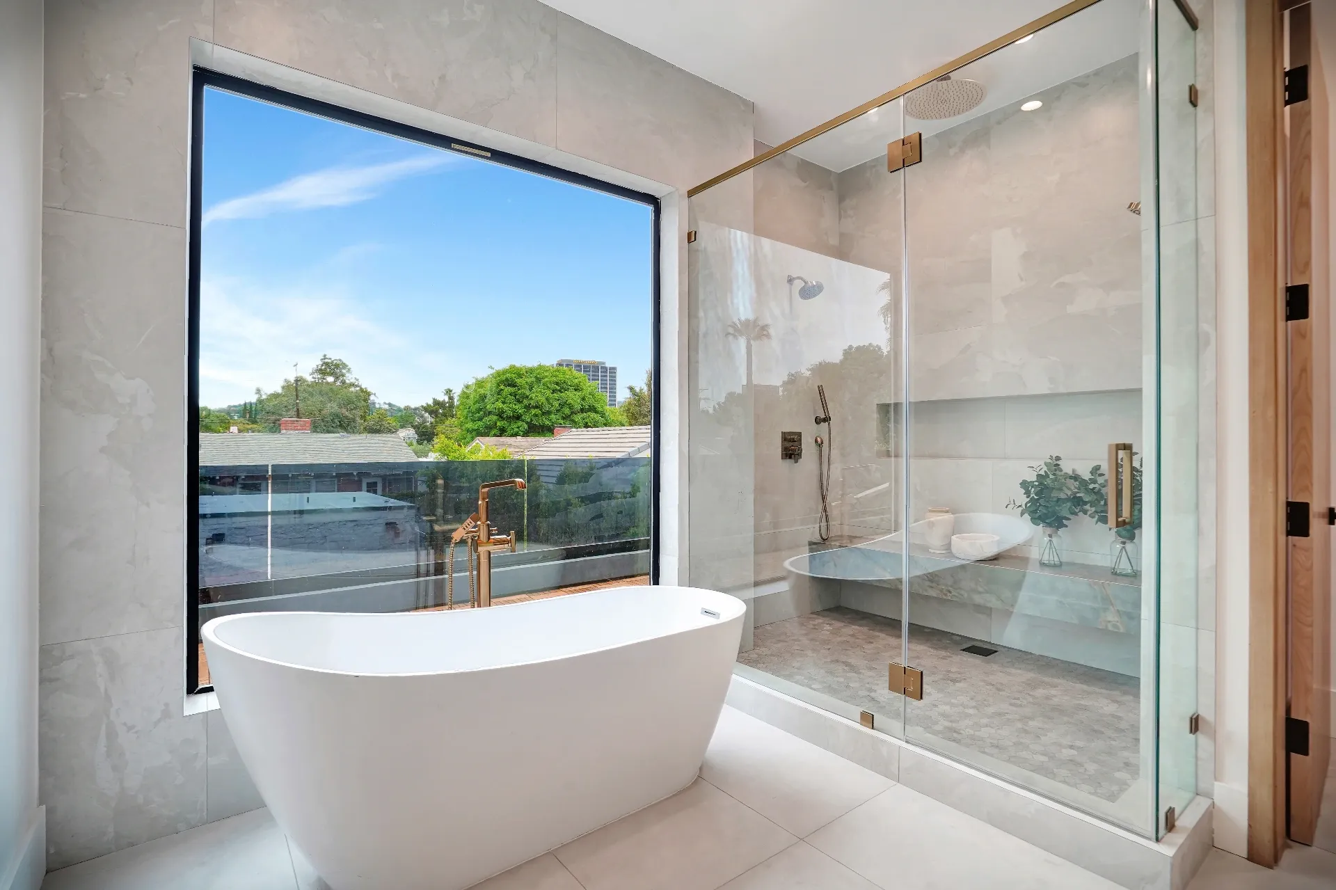 15602 Morrison St — Bathrooms: 15602 Morrison St — Master bathroom with freestanding soaking tub, glass shower enclosure, marble walls, and brass hardware