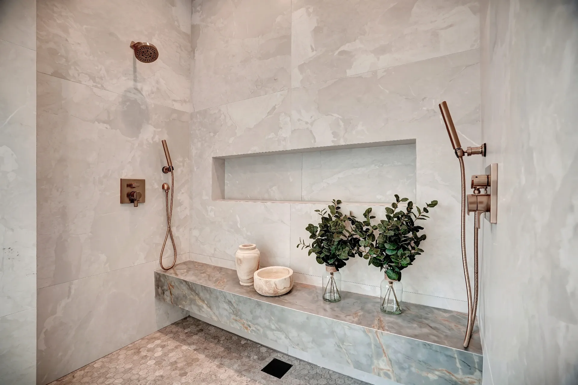 15602 Morrison St — Bathrooms: 15602 Morrison St — spa like shower with marble bench seating, built-in storage niches, and brass rainfall showerhead