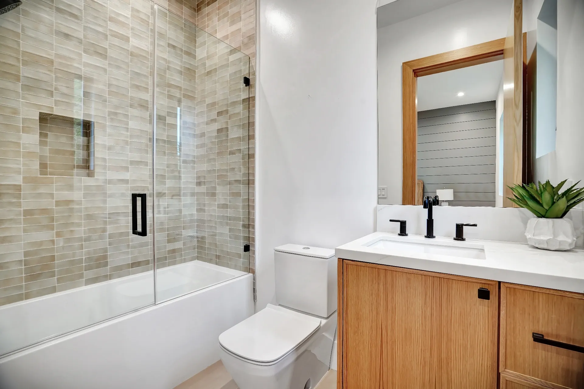 15602 Morrison St — Bathrooms: 15602 Morrison St — Modern bathroom with geometric tile shower, wood vanity, and contemporary design elements