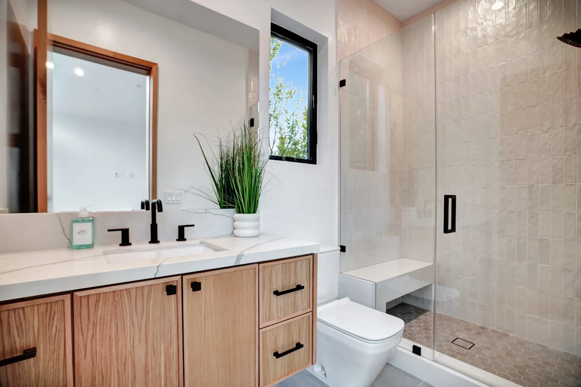 15602 Morrison St — Bathrooms: 15602 Morrison St — Guest bathroom featuring tub-shower combination, wood cabinetry, and neutral tile finishes