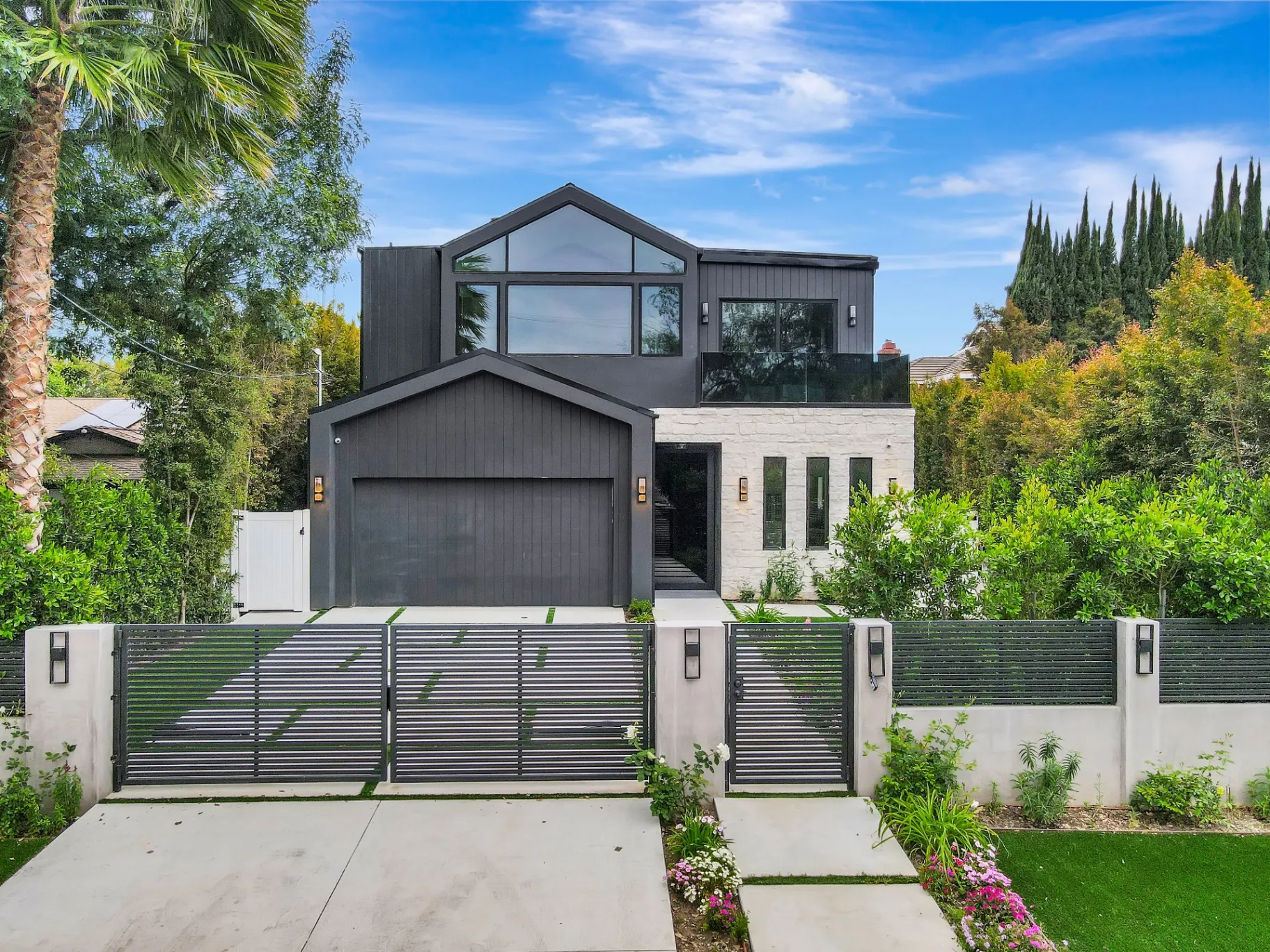 15602 Morrison St — Exterior: 15602 Morrison St — Contemporary architecture featuring horizontal-slat privacy fencing, artificial turf, and concrete paver driveway
