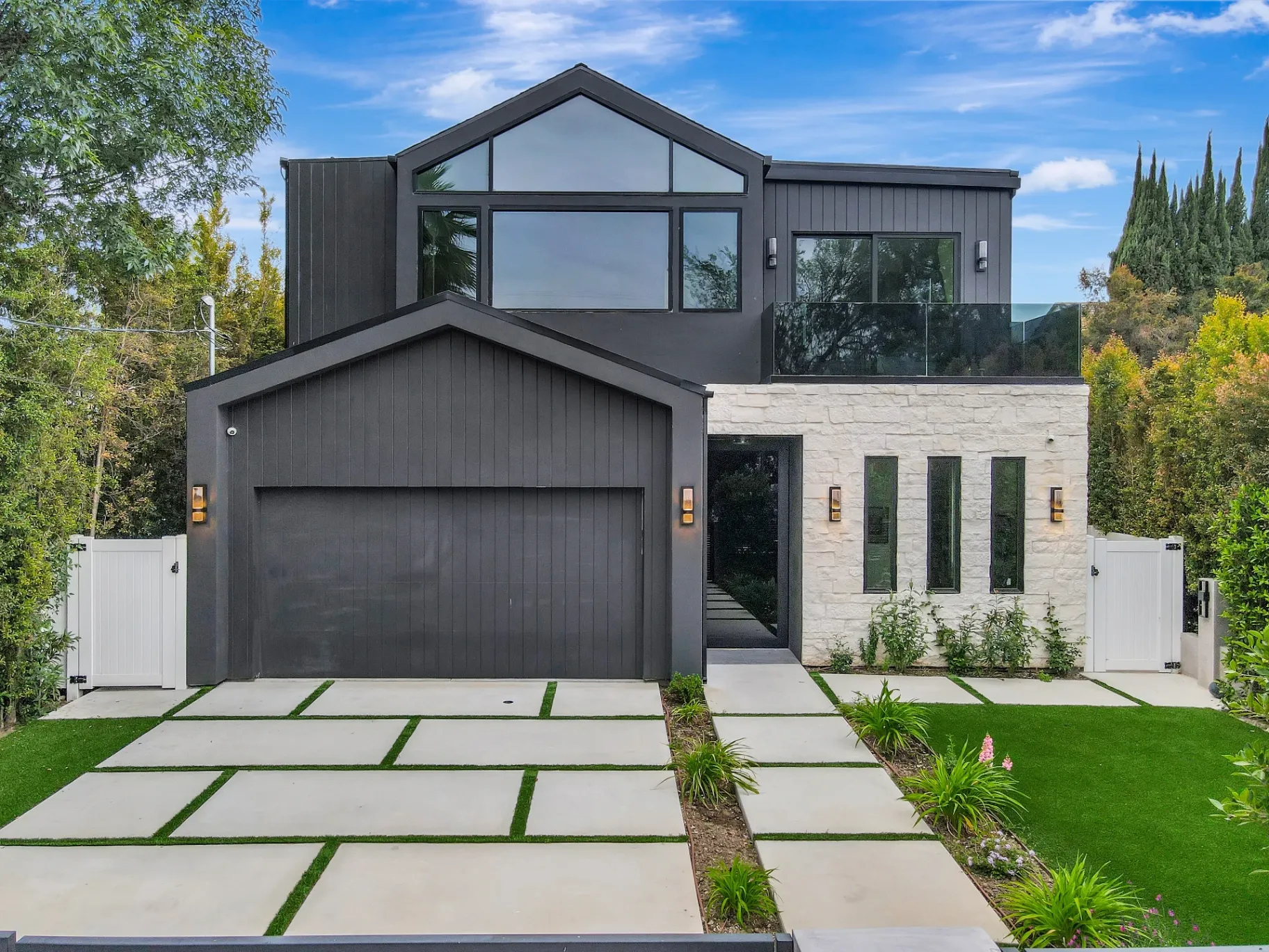 15602 Morrison St — Exterior: 15602 Morrison St — Contemporary architecture with dark vertical siding, stone accents, and geometric front yard landscaping design