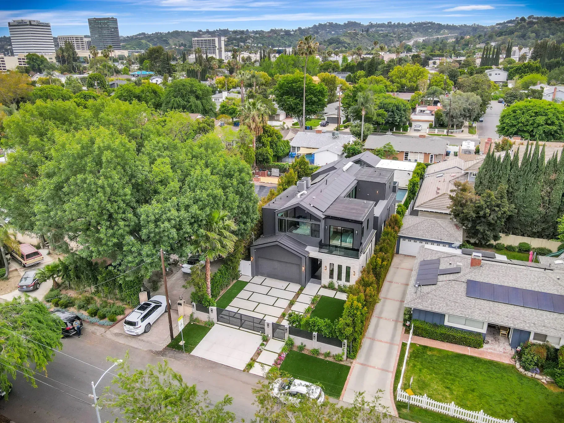 15602 Morrison St — Exterior: 15602 Morrison St — Aerial neighborhood view of modern contemporary home with dark exterior, artificial grass front yard, and Sherman Oaks context