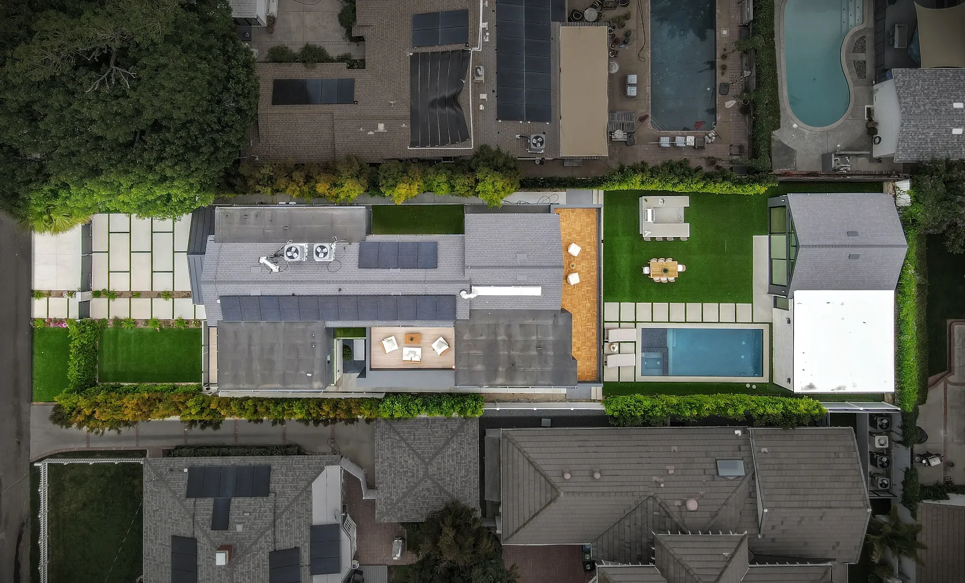 15602 Morrison St — Exterior: 15602 Morrison St — Overhead aerial view showcasing modern home layout with pool, outdoor entertainment areas, and contemporary architecture
