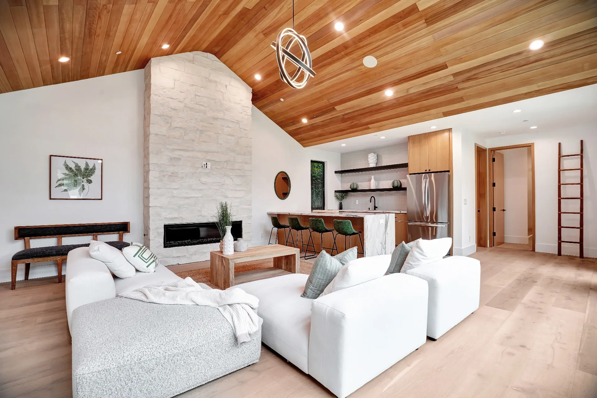 15602 Morrison St — Guest House: 15602 Morrison St — Guest house open concept living and kitchen with wood ceiling, marble island, and contemporary design