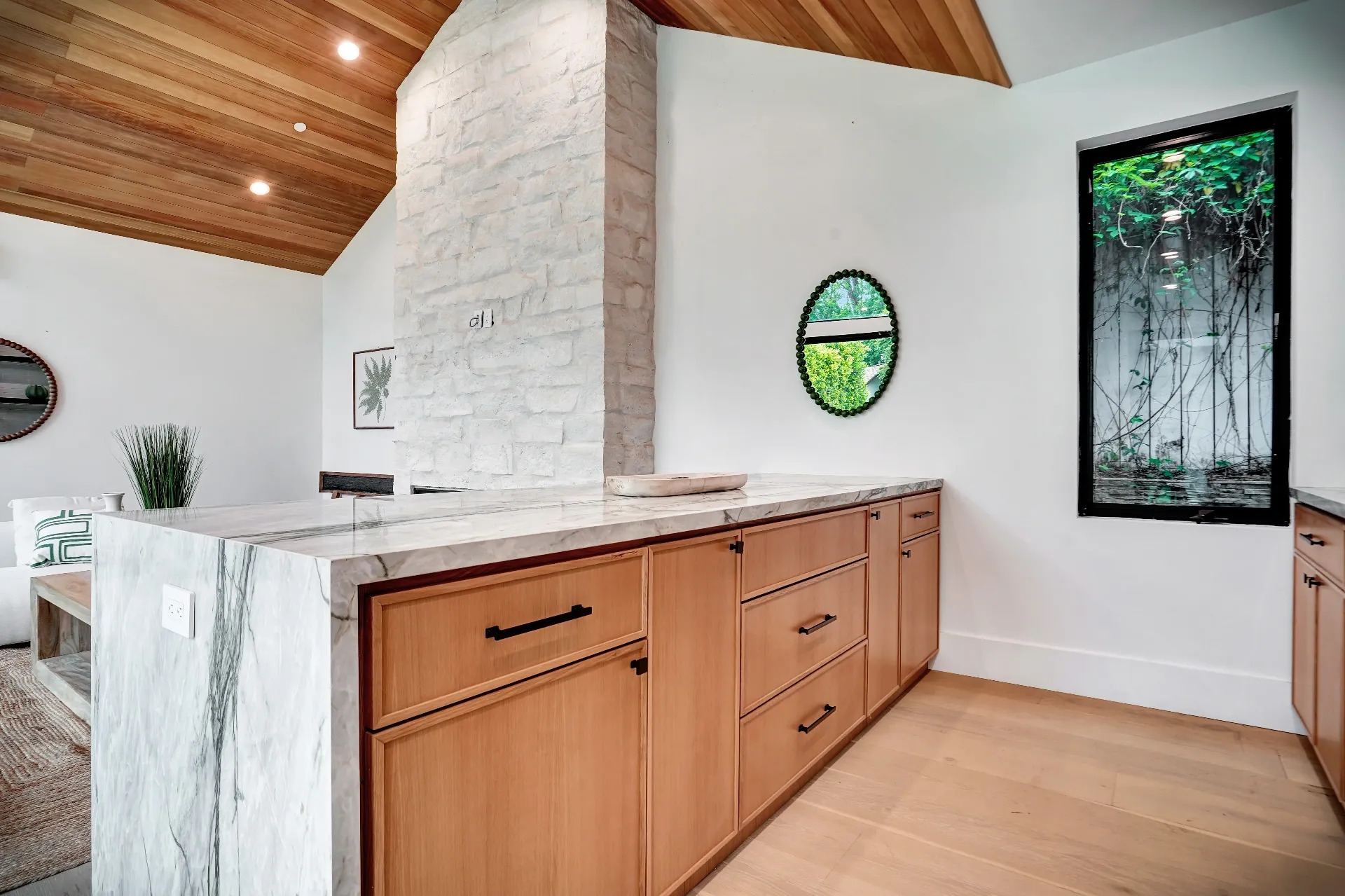 15602 Morrison St — Guest House: 15602 Morrison St — Guest house kitchen and living area with wood ceiling, marble island, and contemporary interior design