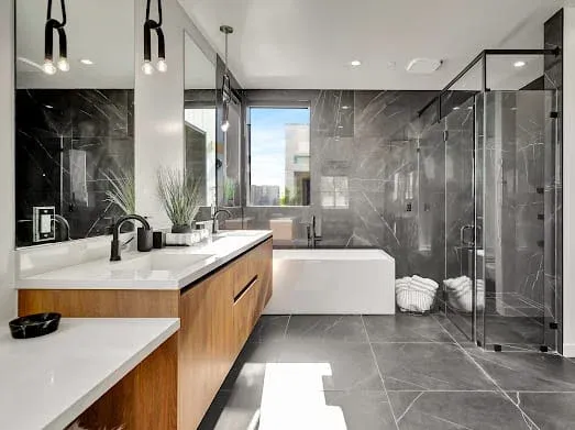 124 S Croft Ave — Bathrooms: Primary ensuite with wood vanity, marble shower, and soaking tub