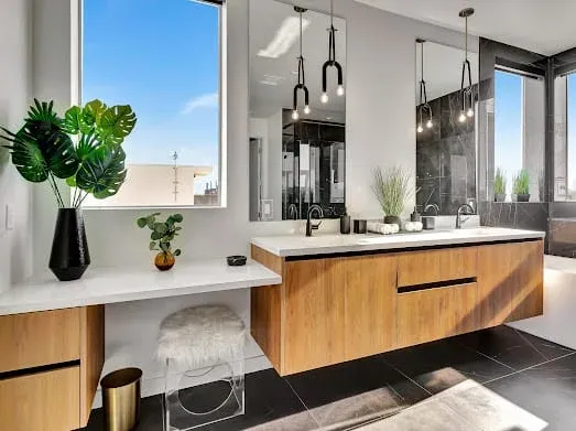 124 S Croft Ave — Bathrooms: Contemporary vanity area with floating wood cabinetry and pendant lighting