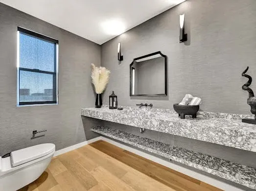 124 S Croft Ave — Bathrooms: Powder room with terrazzo countertop and modern wall-mounted fixtures