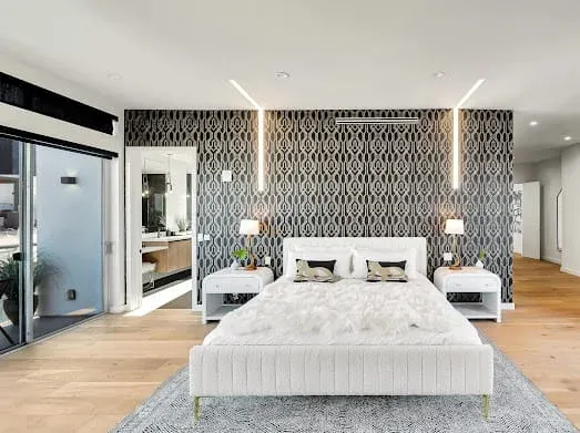 124 S Croft Ave — Bedrooms: Master bedroom with patterned wallpaper and contemporary furnishings