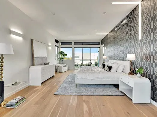 124 S Croft Ave — Bedrooms: Elegant bedroom with geometric wallpaper and panoramic windows