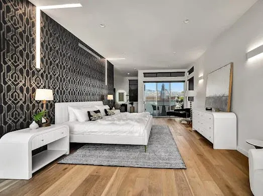124 S Croft Ave — Bedrooms: Contemporary bedroom with accent wall and white furniture