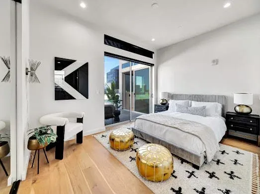 124 S Croft Ave — Bedrooms: Bright bedroom with contemporary art and outdoor terrace access