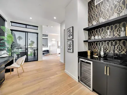 124 S Croft Ave — Kitchen: Wet bar area with decorative backsplash and built-in wine storage