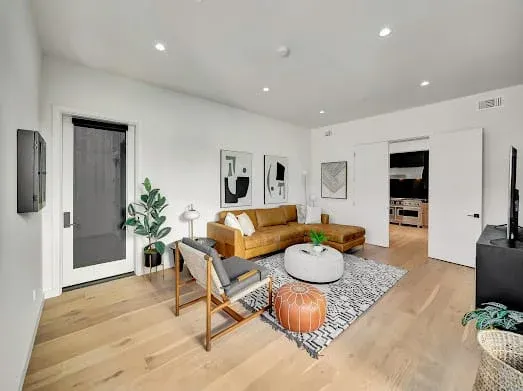 124 S Croft Ave — Living Areas: Living area featuring luxury leather furniture and modern lighting