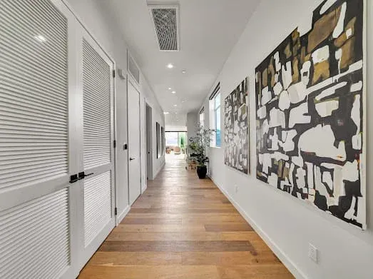 124 S Croft Ave — Living Areas: Gallery hallway with contemporary art collection and architectural details