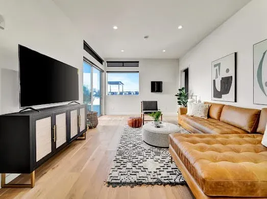 124 S Croft Ave — Living Areas: Entertainment area with media console and comfortable seating arrangement