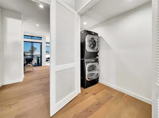 124 S Croft Ave — Living Areas: Laundry area with premium stacked washer and dryer units