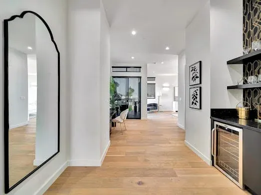 124 S Croft Ave — Living Areas: Modern hallway with arched doorway and kitchen views