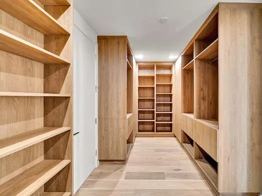 124 S Croft Ave — Living Areas: Walk-in closet with custom wooden shelving and storage systems