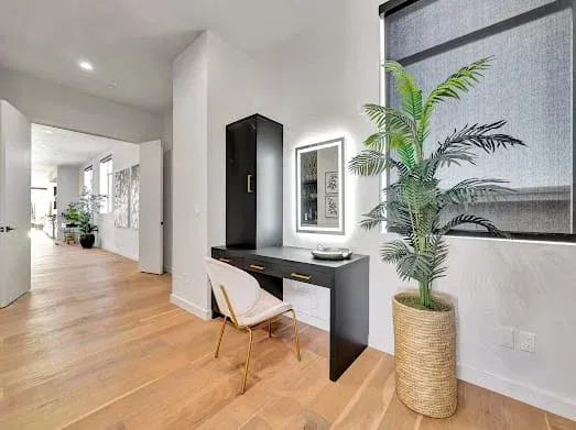 124 S Croft Ave — Living Areas: Contemporary work area with built-in desk and decorative plant
